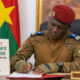 Captain Ibrahim Traoré signing economic sovereignty decree in Ouagadougou, reinforcing local content requirements