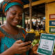 African woman using mobile phone for mobile money transaction highlighting financial inclusion expansion