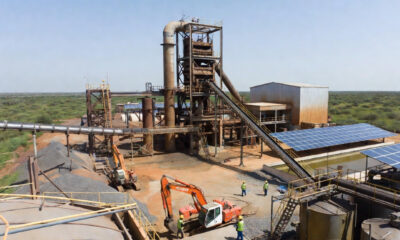 African mineral processing plant with workers and heavy machinery, highlighting the need for sustainable industrialization and reliable infrastructure across the continent.