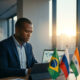 African entrepreneur reviewing global trade data with BRICS nation flags, illustrating Africa's growing trade ties with Brazil, Russia, India, China, and South Africa
