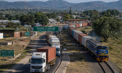 Freight trucks and rail lines passing through Zimbabwe, illustrating its role as a vital transit hub for Southern African regional trade and logistics