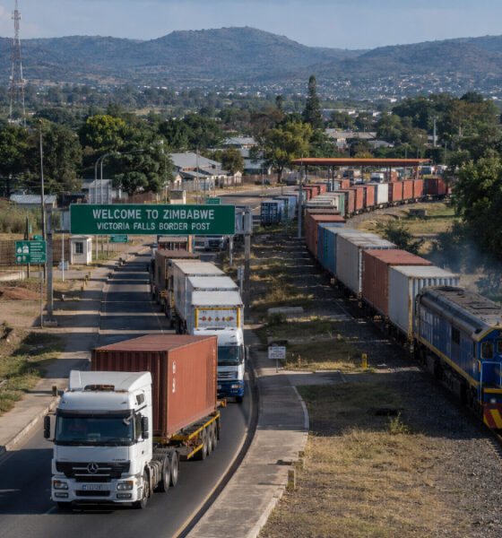 Freight trucks and rail lines passing through Zimbabwe, illustrating its role as a vital transit hub for Southern African regional trade and logistics