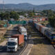 Freight trucks and rail lines passing through Zimbabwe, illustrating its role as a vital transit hub for Southern African regional trade and logistics