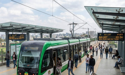 Addis Ababa Light Rail Transit train at modern station platform with commuters, Ethiopia's first electrified light rail system in Sub-Saharan Africa