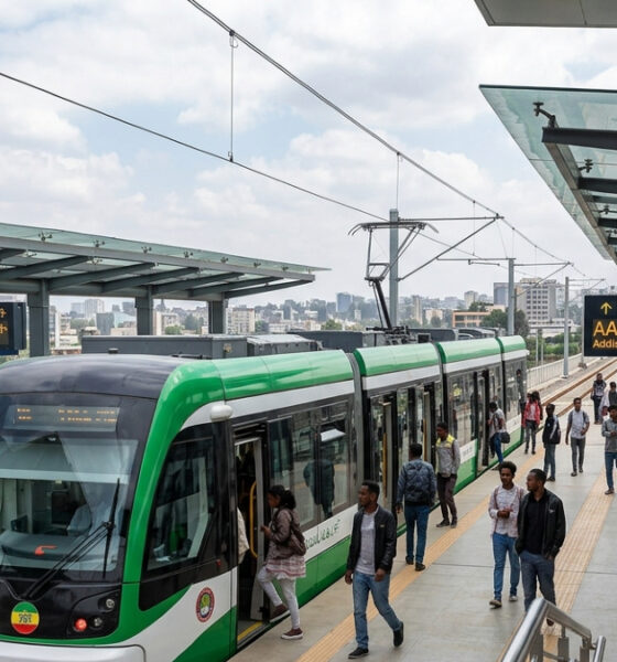 Addis Ababa Light Rail Transit train at modern station platform with commuters, Ethiopia's first electrified light rail system in Sub-Saharan Africa