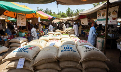 Burkina Faso rice sacks in a West African market, highlighting the impact of the rice import ban on regional trade and food sovereignty.