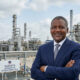 Aliko Dangote, chairman of Dangote Group, standing before the Dangote Refinery near Lagos, Nigeria, as part of the company's $100 billion expansion plan