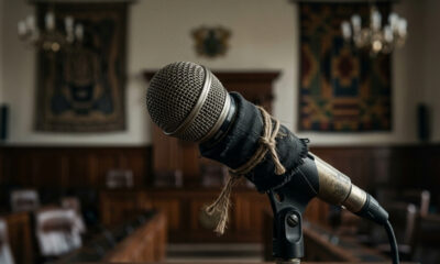 A silenced microphone symbolizing ethical surrender and quiet complicity in Africa's leadership and institutional crisis.