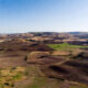Aerial view of uncultivated arable farmland in Africa, highlighting the continent's untapped agricultural land potential.
