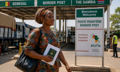 Woman entrepreneur crossing an African border post, illustrating the AfCFTA Protocol on Women and Youth in Trade