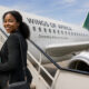 African businesswoman boarding a flight, symbolizing intra-African trade mobility and visa-free travel across the continent