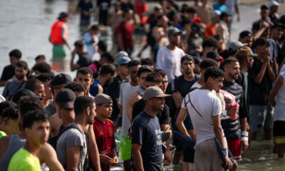 Migrants crossing the sea border into Ceuta, Spain during the 2026 migration crisis from Morocco