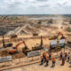 African mining operations highlighting the economic impact of resource nationalism and human rights.
