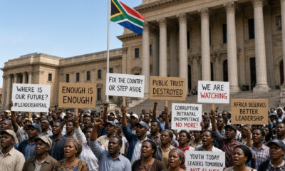 Citizens of an African country gathered and protesting outside a government building, reflecting declining public trust amid Africa's leadership crisis