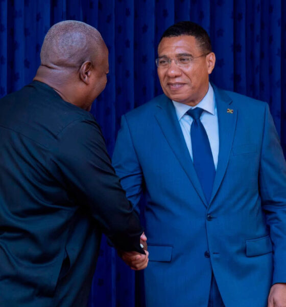 Ghanaian President John Mahama and Jamaican Prime Minister Andrew Holness shake hands during state visit, announcing Africa-Caribbean free trade proposal and direct Accra-Montego Bay flights.