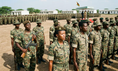African soldiers in formation during a military review, representing the continent's frequent command reshuffles and the tension between professionalism and presidential loyalty