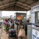 Small-scale traders crossing a Southern African border post under the SADC Simplified Trade Regime, which aims to simplify customs procedures for cross-border trade.