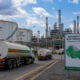 Fuel tanker trucks and refinery infrastructure symbolizing West Africa's regional fuel market and pricing benchmark integration
