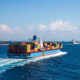 Ships with containers on the high seas illustrating high maritime traffic bypassing African ports