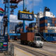 Cargo containers being loaded at a South African port, serving as a logistics hub for African exports to BRICS nations.