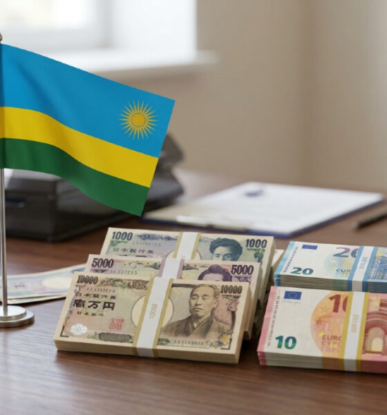 Rwandan flag beside Japanese yen and euro banknotes, symbolizing Rwanda's multi-currency loan