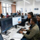 African university students learning machine learning and data science skills in a modern computer lab, building the next generation of AI researchers and engineers