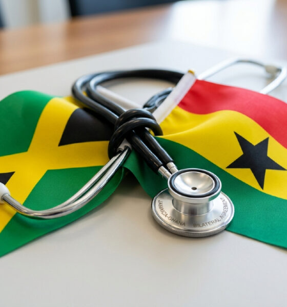 Jamaican and Ghanaian flags, bound with a stethoscope symbolizing the bilateral nurse recruitment agreement between Jamaica and Ghana.