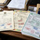 Close-up of conformity assessment certificates and quality compliance stamps for African manufactured exports.