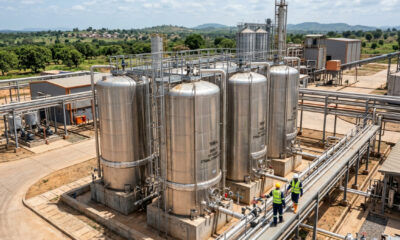 Industrial ethanol distillation facility processing cashew apples into high-strength alcohol in West Africa.