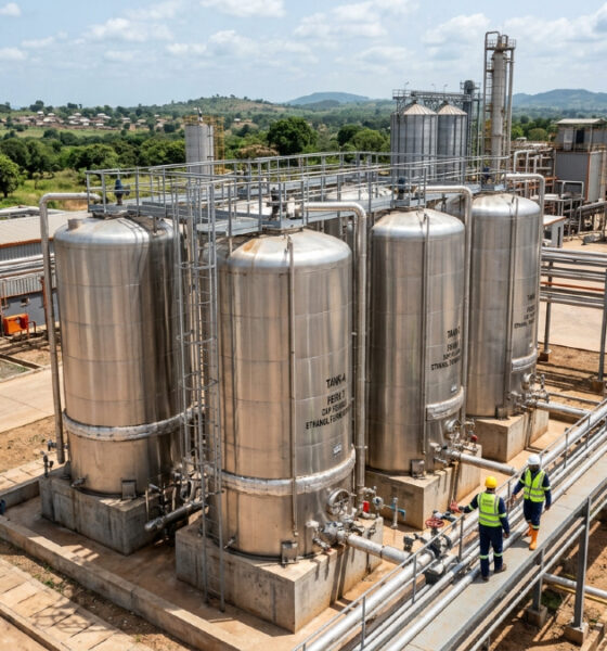 Industrial ethanol distillation facility processing cashew apples into high-strength alcohol in West Africa.