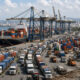 Busy African cargo port highlighting the logistical barriers and infrastructure needs for seamless intra-African trade.