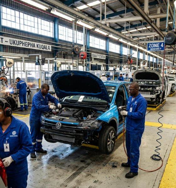 Workers assemble vehicles on a South African car factory floor as SKD subsidies end.