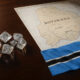 Rough diamonds on a table beside a map of Botswana, symbolizing the country’s bid for De Beers ownership
