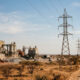 Electricity pylons beside a mineral processing plant in Africa