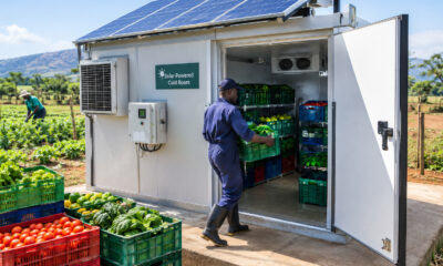 Solar-powered cold room storing fresh produce crates at an African farm