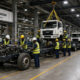 Workers assembling commercial trucks at the FAW-Rostar automotive manufacturing plant in Bagamoyo, Tanzania.