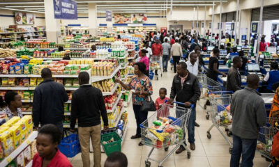 Shoppers in a bustling Nairobi supermarket, illustrating the surface-level activity masking the East Africa retail capital crisis.
