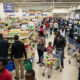 Shoppers in a bustling Nairobi supermarket, illustrating the surface-level activity masking the East Africa retail capital crisis.