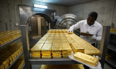 Gold bars stacked in a vault, representing Ghana’s GoldBod reserves