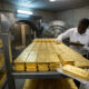 Gold bars stacked in a vault, representing Ghana’s GoldBod reserves